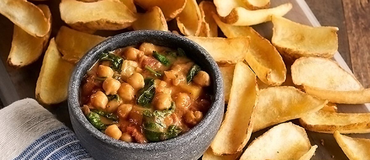 potato fry chips and chic pea dip in a bowl