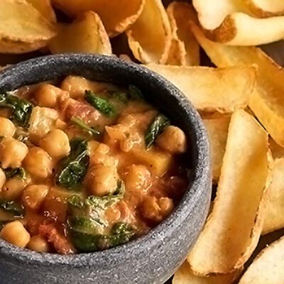 potato fry chips and chic pea dip in a bowl