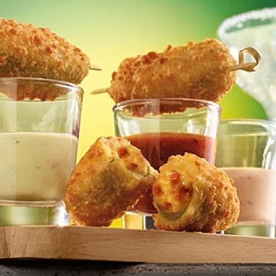 bacon cheddar jalapeno poppers with sauces in shot glasses