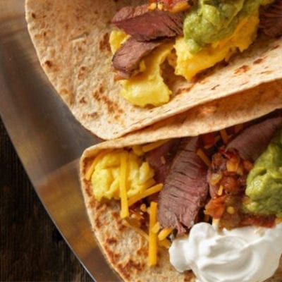 beef taco with guacamole cheese and sour cream