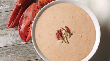 lobster bisquelobster bisque in a bowl with garnish