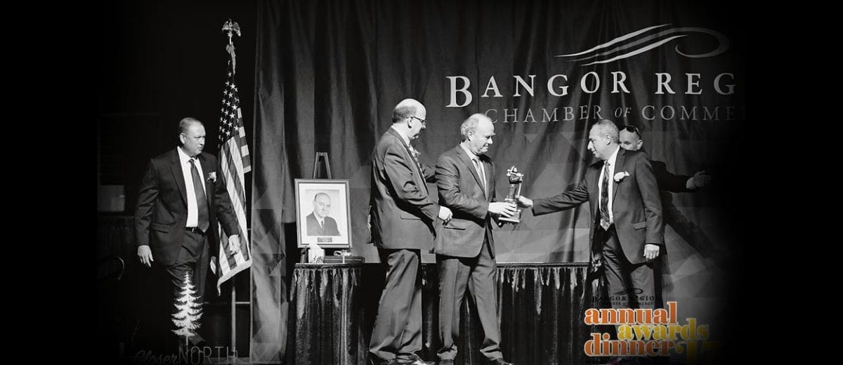 Men accepting award