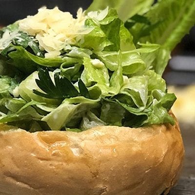 caesar salad in a bread bowl