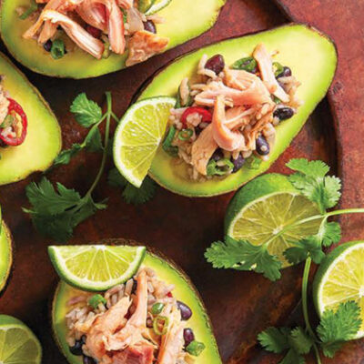 Gallo Pinto with chicken served in half an avocado with plantain chips