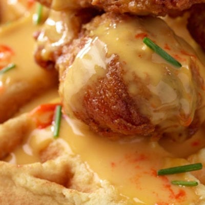 fried chicken on waffles with sauce