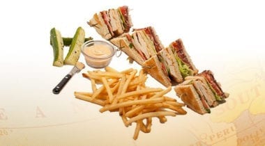 chicken club sandwich with fries and pickles