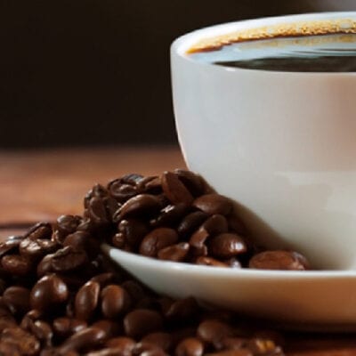 cup of coffee with coffee beans