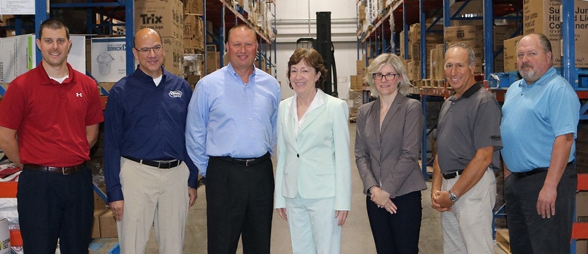 warehouse tour, man and two women