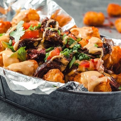 tater tot nachos topped with kogi sauce