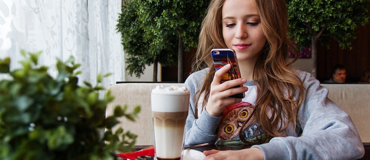 girl looking at phone