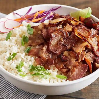 cooked shaved pork belly on a rice bowl