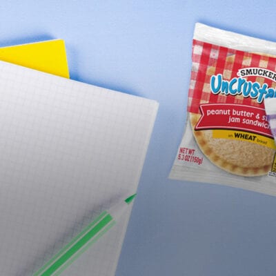 individually wrapped smuckers uncrustables on school table