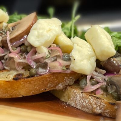 mushrooms, onions, and cheese curds on bread