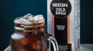 nescafe iced coffee concentrate carton with glass mug of iced coffee