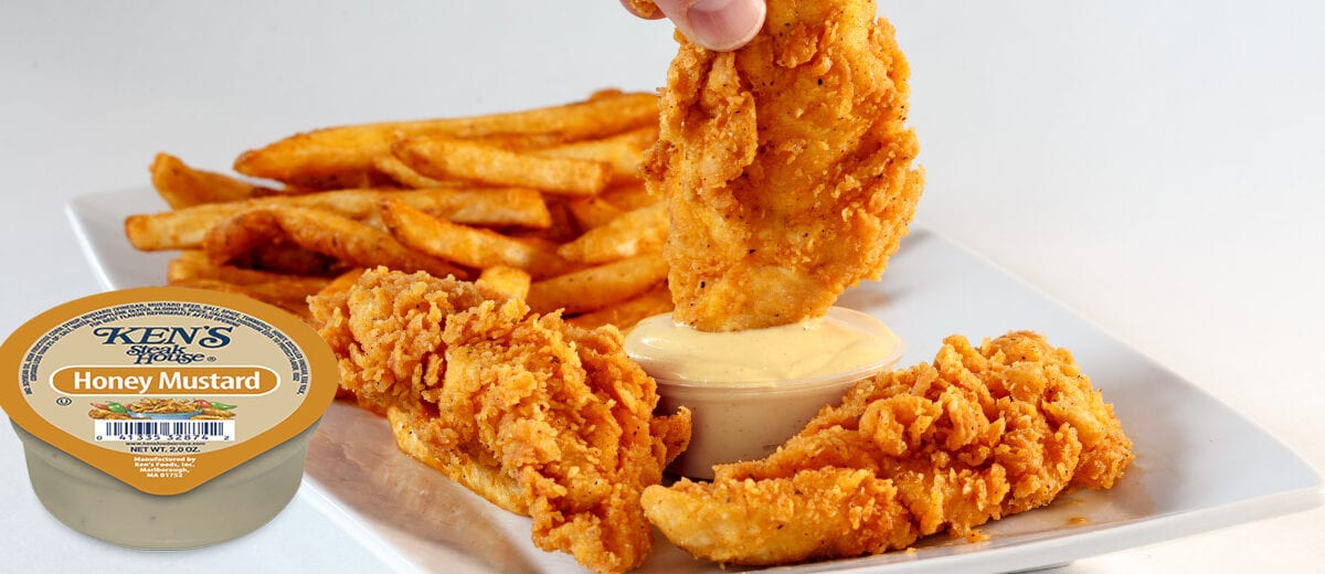 chicken tenders and French fries with honey mustard dipping sauce