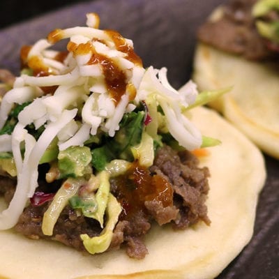 sesame beef with slaw on naan