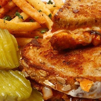 sriracha grilled cheese sandwich with pickles and fries