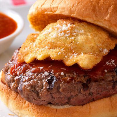 burger topped with fried ravioli