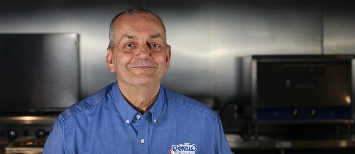 smiling employee in kitchen