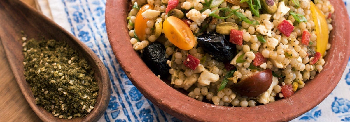 pasta dish with spoon of za'atar seasoning